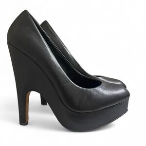 Black Leather platform heels by Dolce Vita